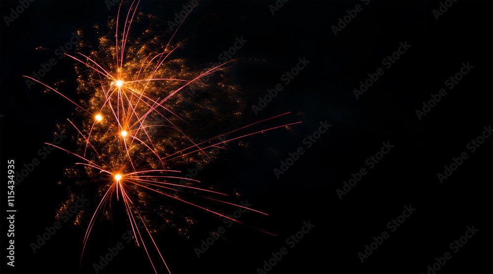Colorful fireworks abstract pattern with glowing lines. Red orange flash on black scene background.