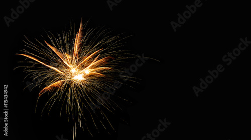 Abstract pyrotechnic glowing explosion on black background. fireworks landscape. Golden flash. Festival card design template.