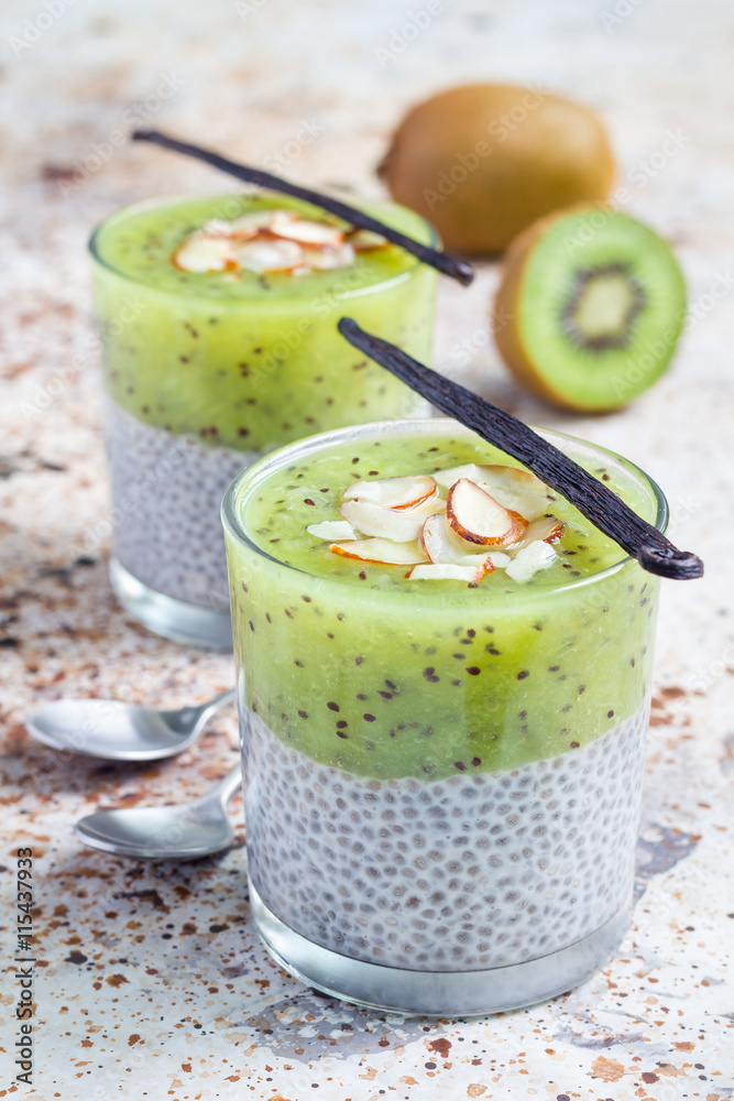 Vanilla chia pudding with kiwi, layered dessert, vertical Vanilla chia pudding with kiwi, layered dessert, vertical