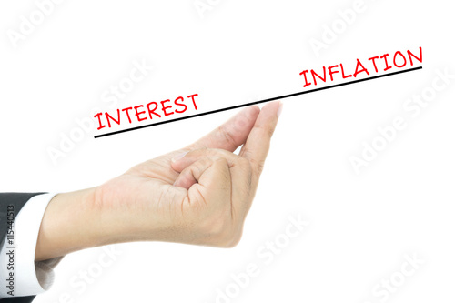 interest and inflation on finger of business man