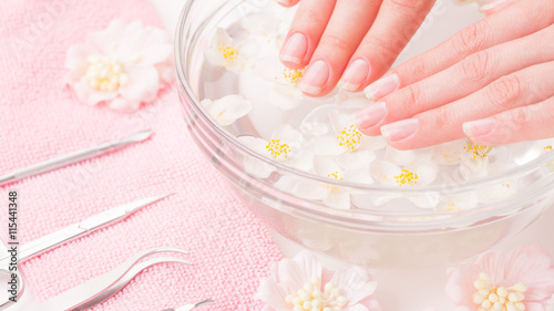 Woman hands in bath with water