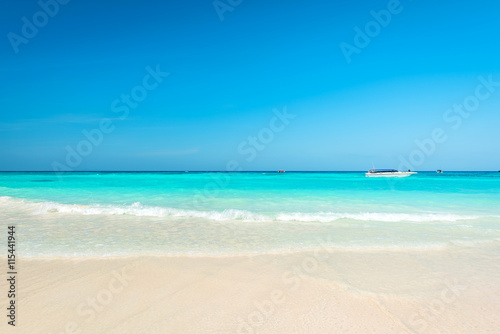 Breathtaking turquoise sea, Exotic beach with gentle wave and clear on beach with blue sky © peangdao