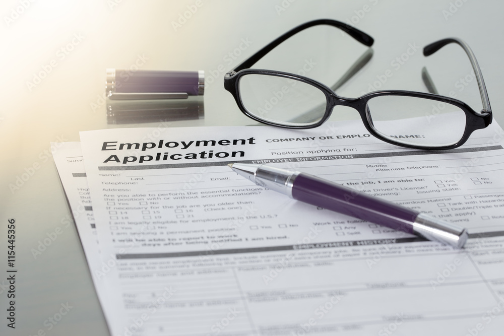 Employment Application information with pen and glesses. job vacancy concept. Employment Application information with pen and glesses. job vacancy concept.