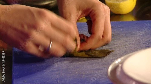 Chef preparing Vine Leaf Rolls photo