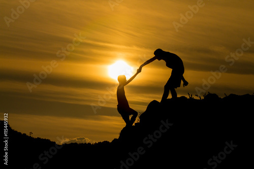 Silhouette of  helping hand of a friend.