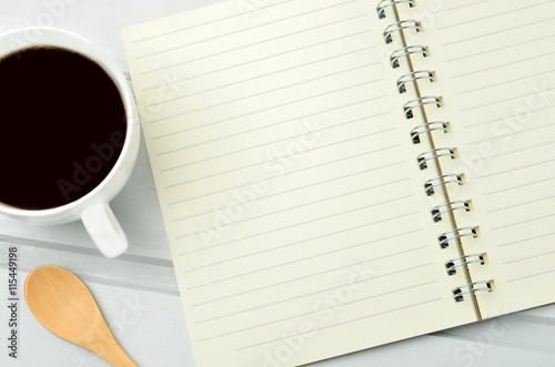 Empty notepad with coffee cup