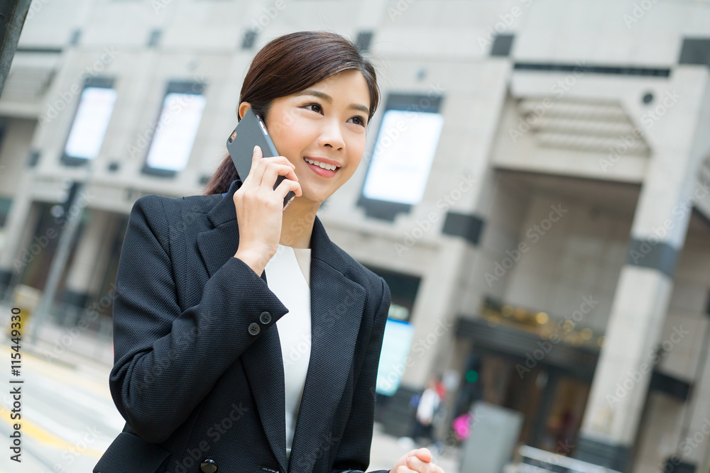 Asian business woman talk to mobile phone Asian business woman talk to mobile phone
