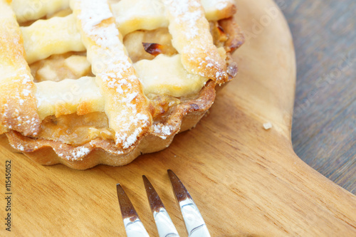 Golden yellow mini apple crumble pie ready to eat photo