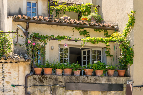 Houses with colorful terraces decorated with plants in the Luberon in the Provence region of the South of France