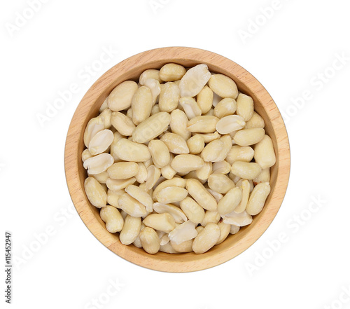 Top view peanuts peel off in wood bowl isolated on white backgro