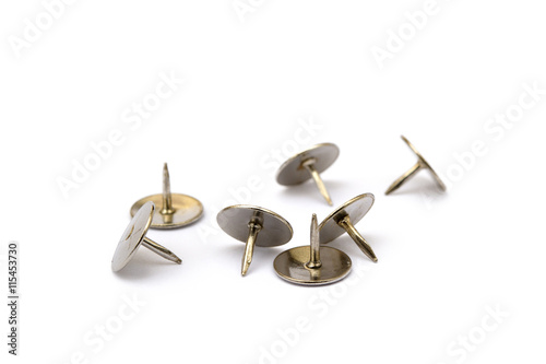 Ordered pile pushpins isolated on white background