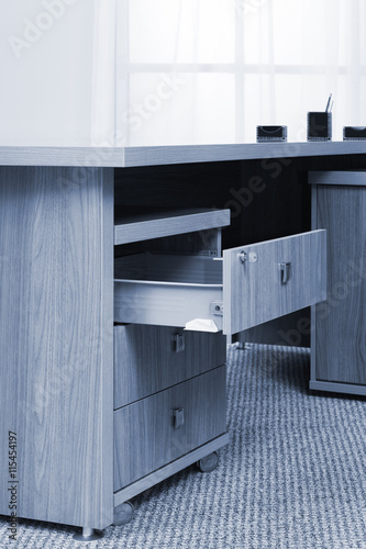 desk with an open drawer