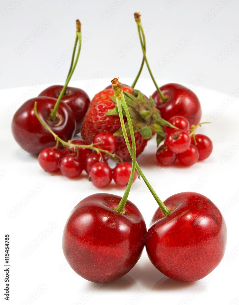 Isolated image of strawberries and cherries Isolated image of strawberries and cherries