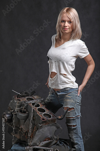 girl in engine oil with wrench key