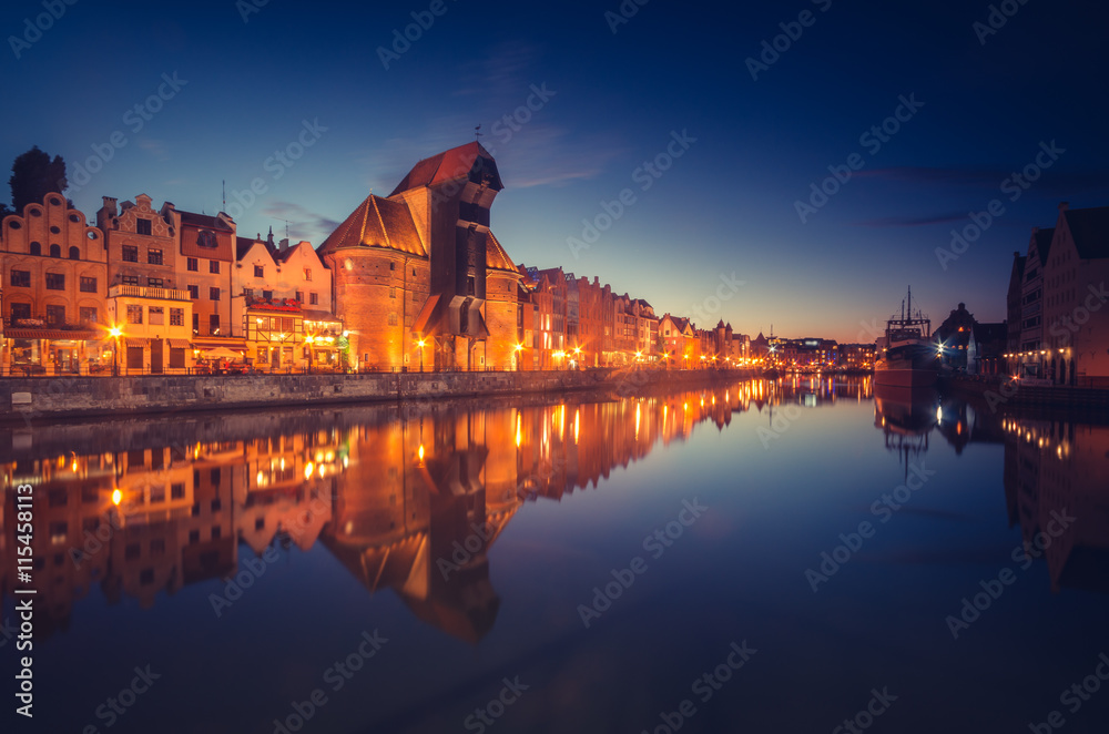 Gdansk old town with harbor and medieval crane in the night
