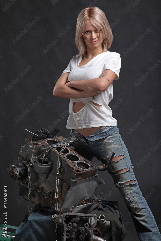 girl in engine oil with wrench key girl in engine oil with wrench key