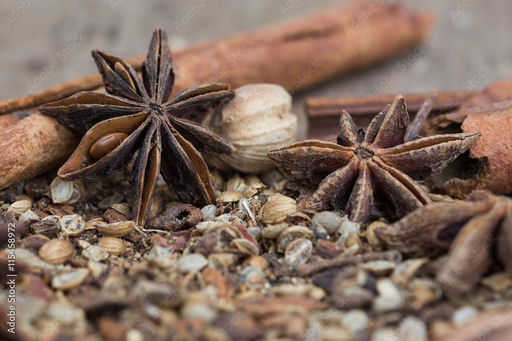 Spices lying on a wooden surface closeup Spices lying on a wooden surface closeup