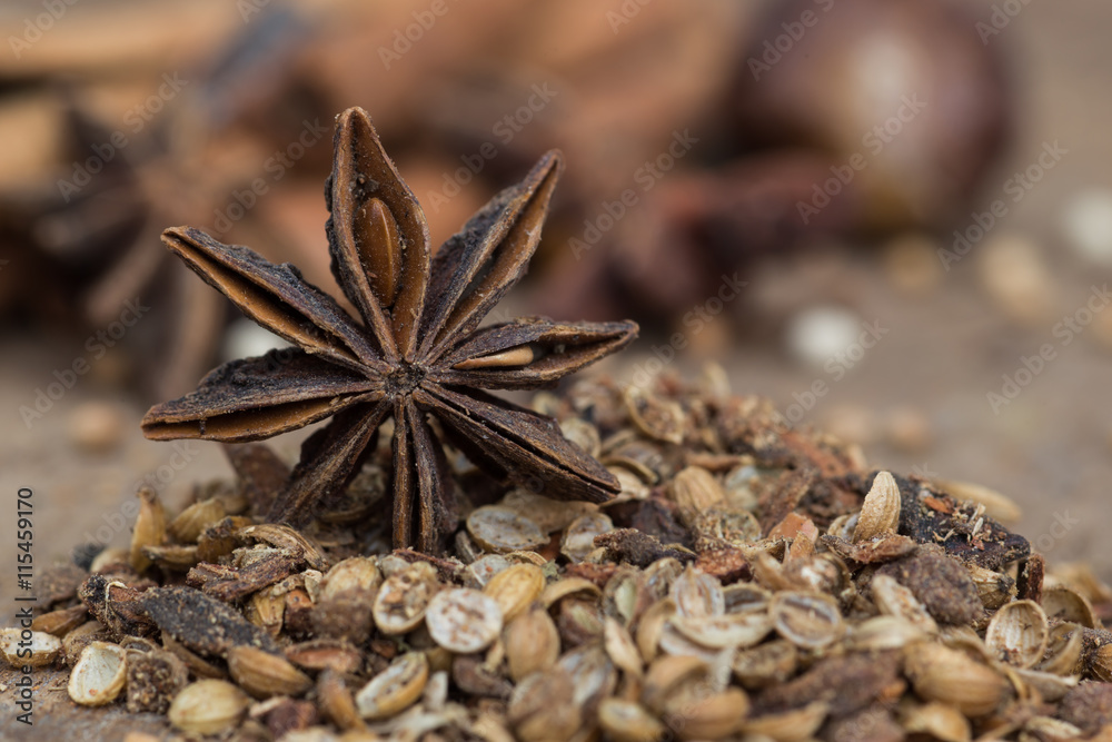Spices lying on a wooden surface closeup Spices lying on a wooden surface closeup
