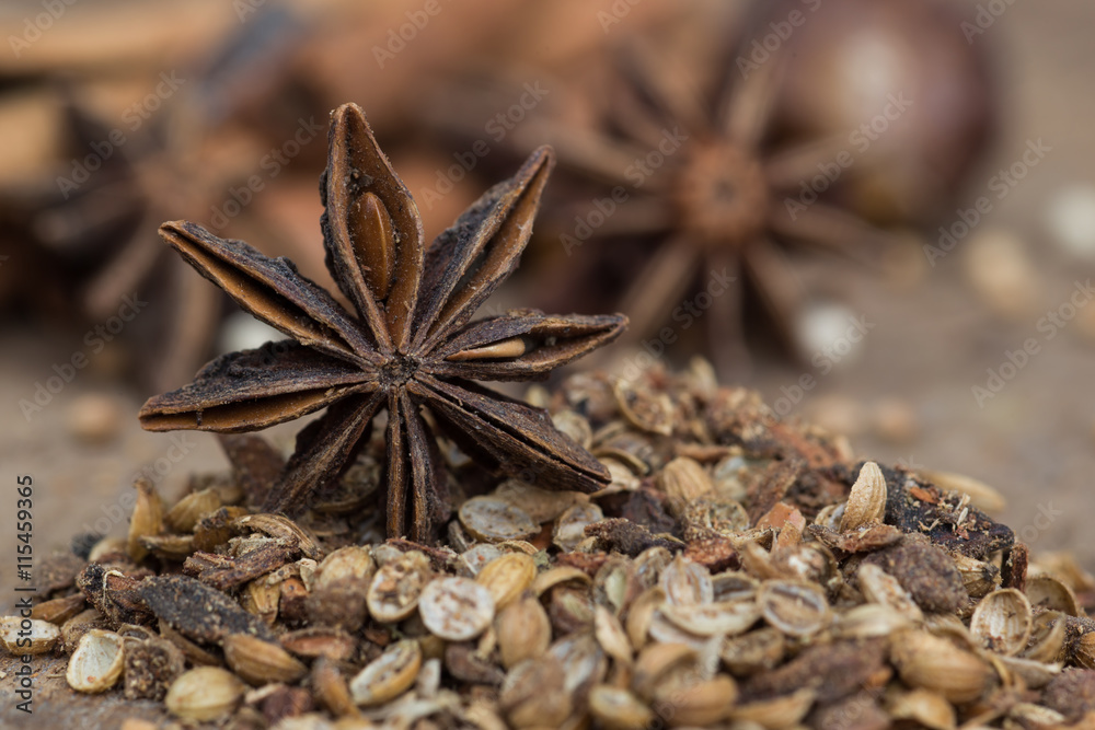 Spices lying on a wooden surface closeup Spices lying on a wooden surface closeup