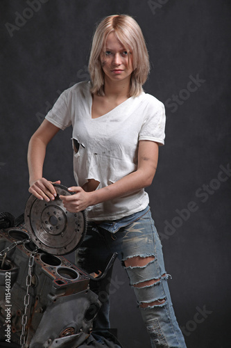 girl in engine oil with wrench key