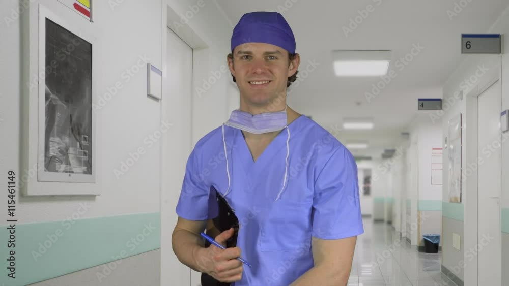Male medical worker smiles on the job Male medical worker smiles on the job