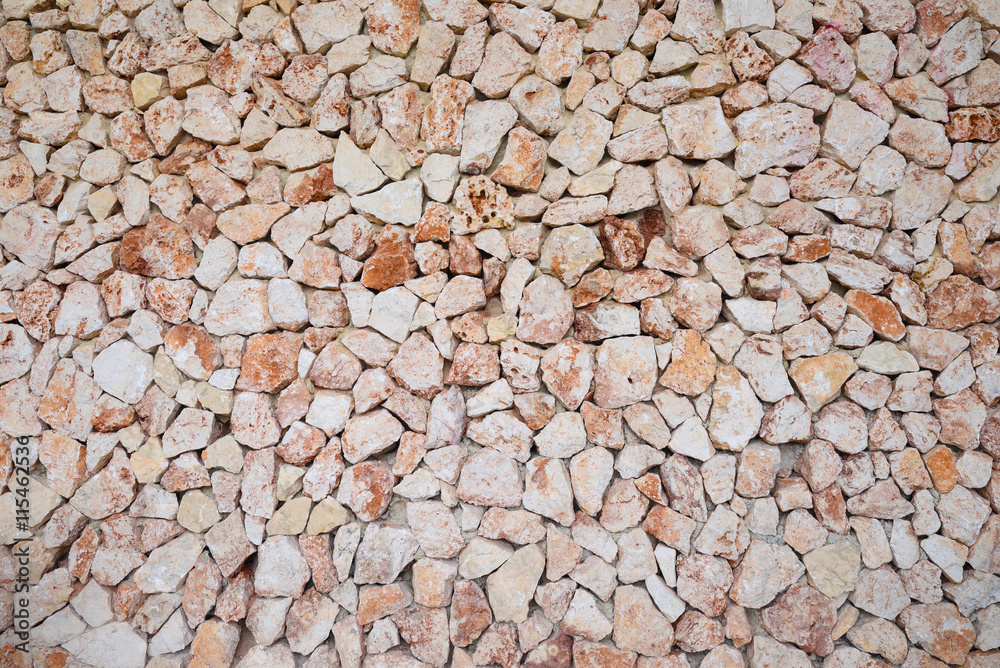 Large wall of brown and pink colored stones texture Large wall of brown and pink colored stones texture