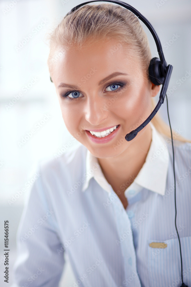 Close-up portrait of a customer service agent sitting at office Close-up portrait of a customer service agent sitting at office