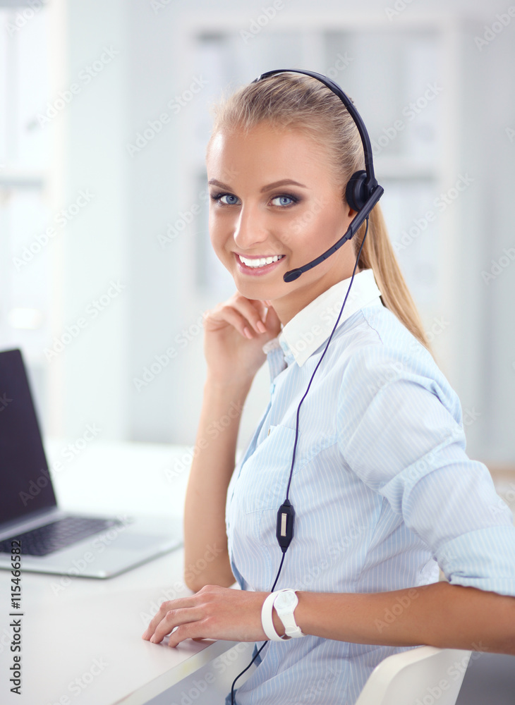Close-up portrait of a customer service agent sitting at office Close-up portrait of a customer service agent sitting at office