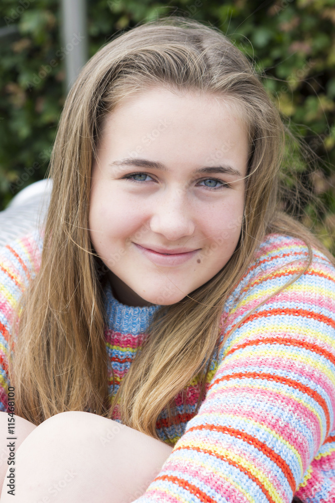 School girl in sweater outdoors