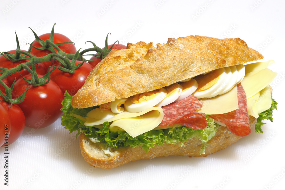 Baguette bun, salami, cheese, lettuce and boiled eggs Baguette bun, salami, cheese, lettuce and boiled eggs