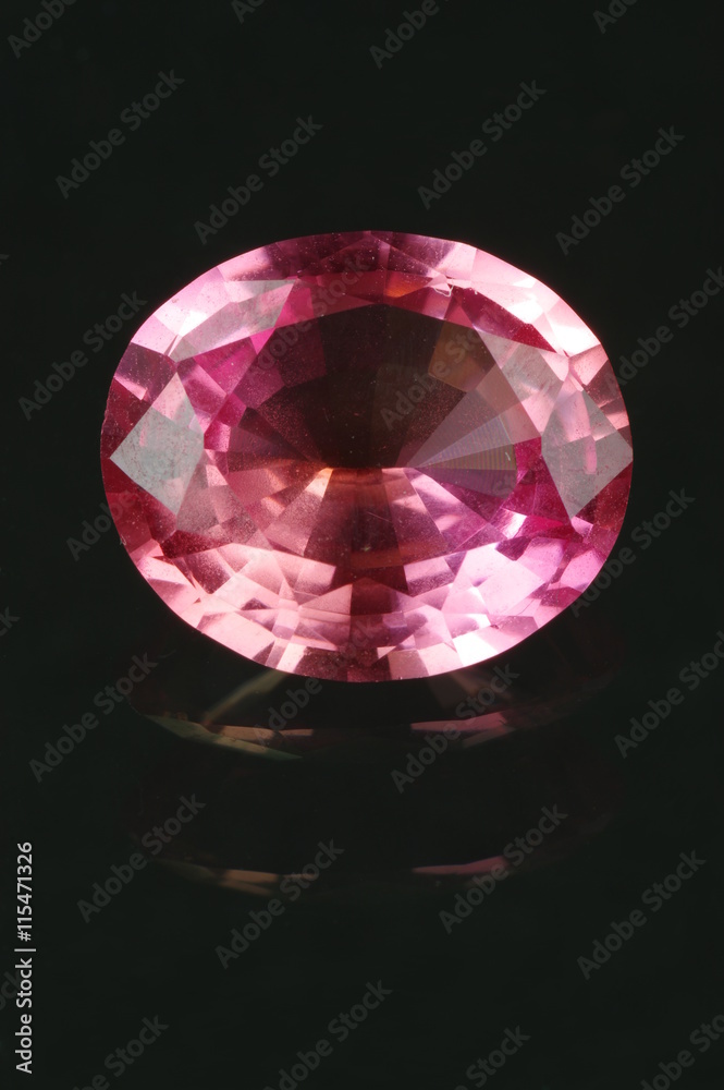 Synthetic corundum, oval cut on the black background. Origin: Skawina, Poland.