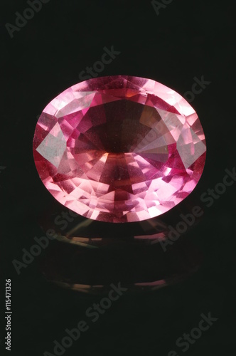 Synthetic corundum, oval cut on the black background. Origin: Skawina, Poland.
