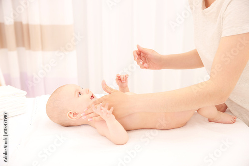 Mother hands applying cream...