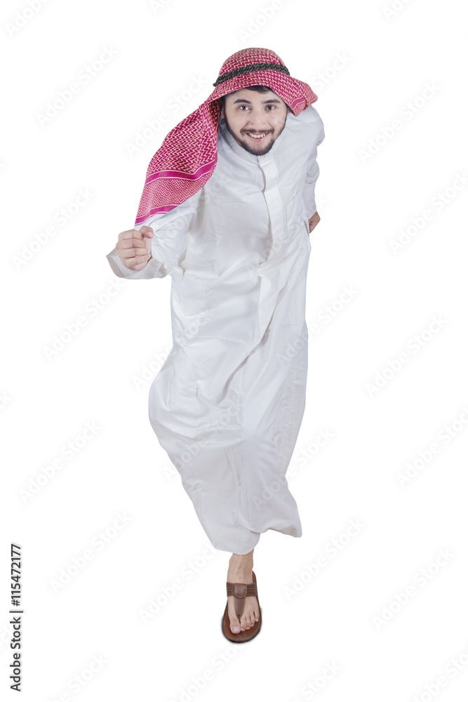 Arabic businessman running in studio Arabic businessman running in studio