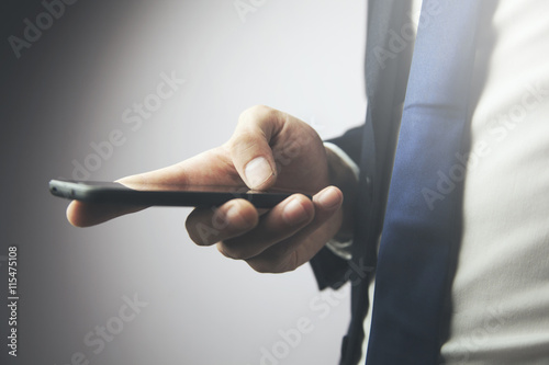 фотографія man hand phone