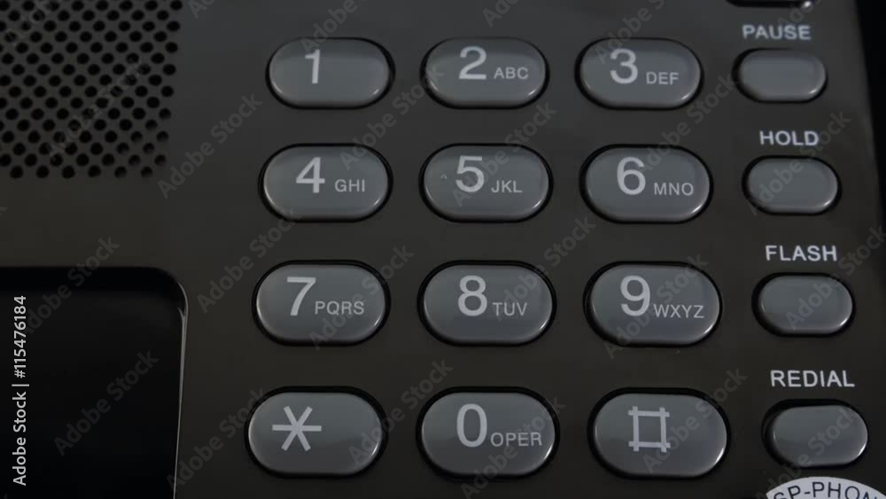 Finger presses each button on the black phone. Closeup Finger presses each button on the black phone. Closeup