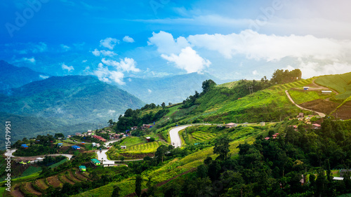 Switchback and village on mountain with blue sky landscape © chaiyabutra