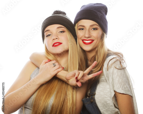 two young girl friends wearing hats