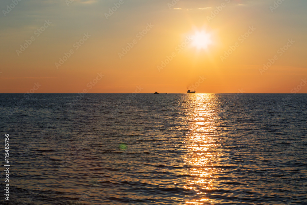Beautiful reflection of rays setting sun in the Black Sea.