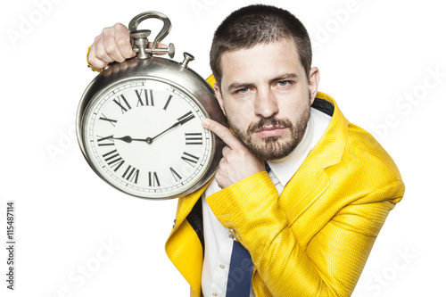 Businessman shows the time on the clock photo