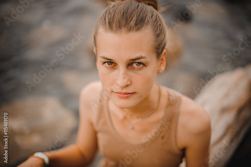 Young attractive woman near the ocean on summer day