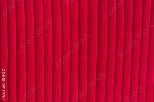 Red pleated fabric texture background 