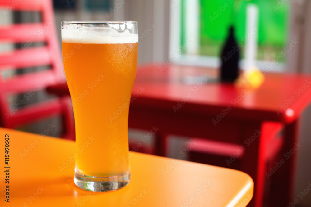 Craft beer pale ale in glass in hipster pub Craft beer pale ale in glass in hipster pub