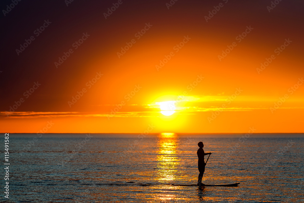 Paddle surfing man