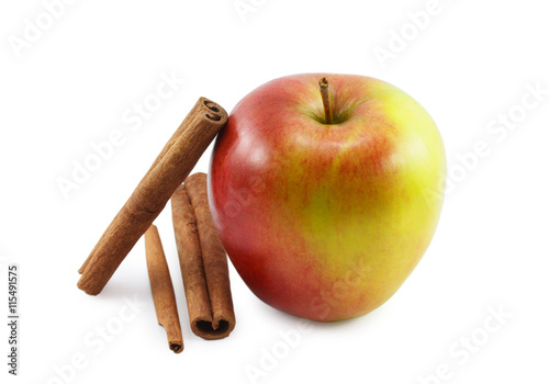 red apple and cinnamon isolated on white background