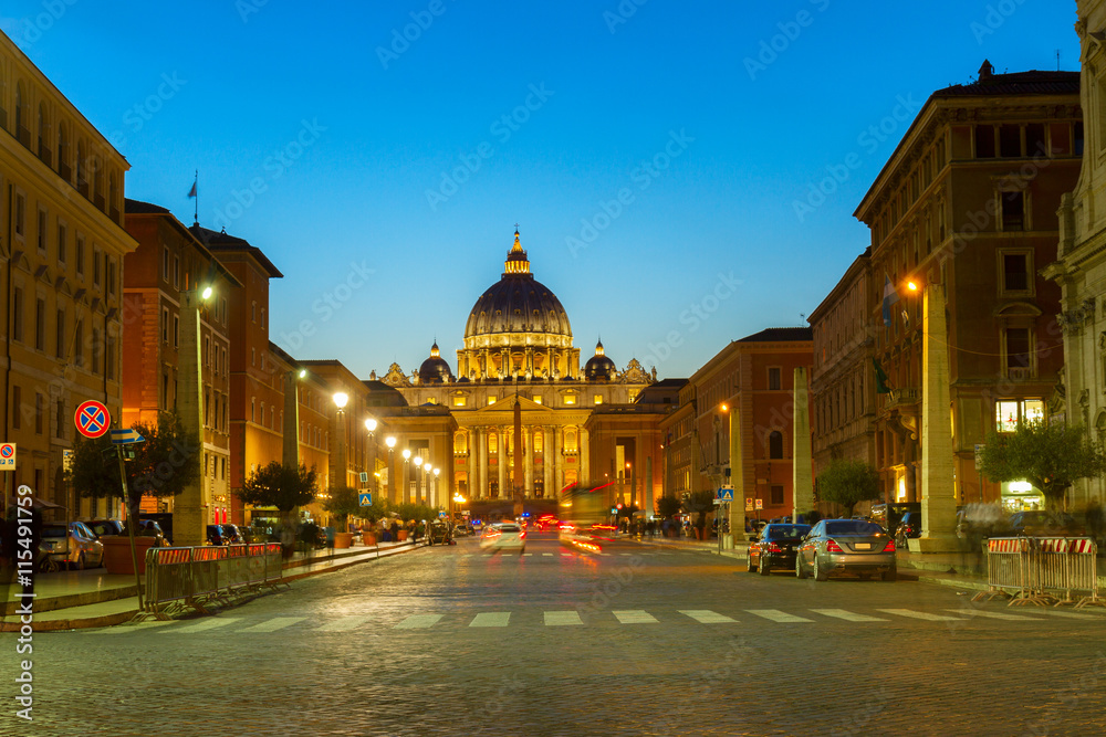 road to St. Peter's cathedral in Rome at night with lights, Italy