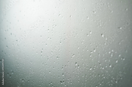 Frosted glass texture with droplets, selective focus, shallow depth of field