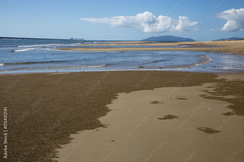 Beach at Lucinda, Far North Queensland, with sugar jetty in the background.