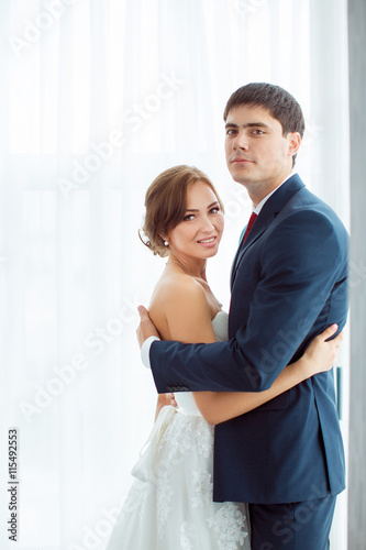 Bride and groom in very bright room at home © Buyanskyy Production