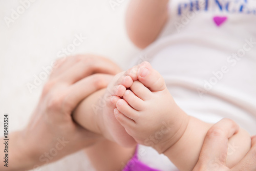 Mother hands holding small baby © makistock